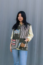 Sleeveless quilted jacket with horse print