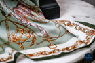 Mint green shield and bits pattern scarf