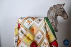 Tangerine green & burgundy squares horses & caps print scarf