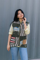 Sleeveless quilted jacket with horse print